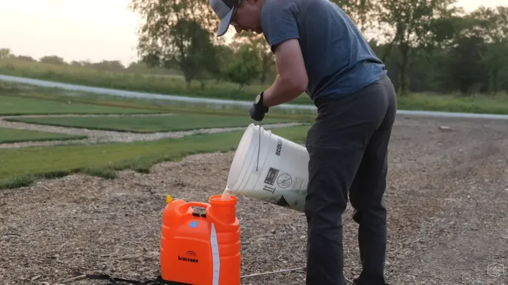 Spreading fertilizer on Abilene lawn